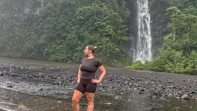 Caitlin in Tahiti by the waterfall