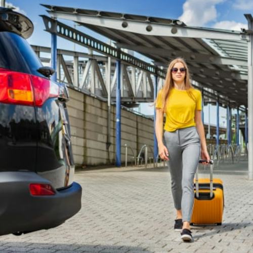Holiday Extras Parking - Woman walking to car