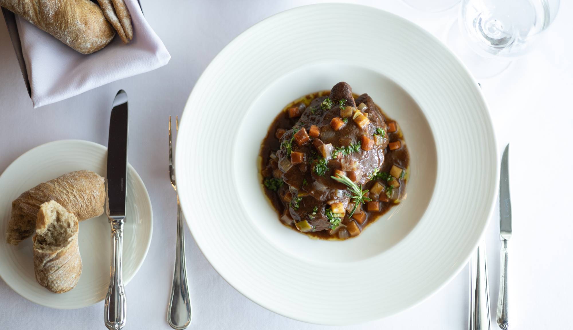 Crystal Cruises - Osteria d'Ovidio - Osso Bucco Veal Shank Braised in its Own Jus, Root Vegetables, Tomato & Fresh Herbs, Served with Mascarpone Polenta 2