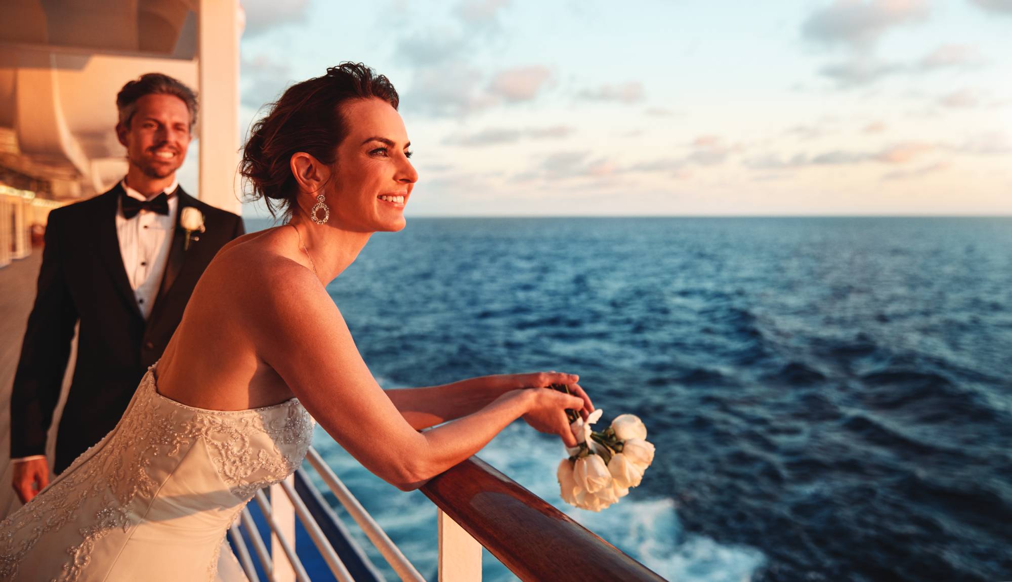 Weddings at Sea - Just married couple looking out to sea