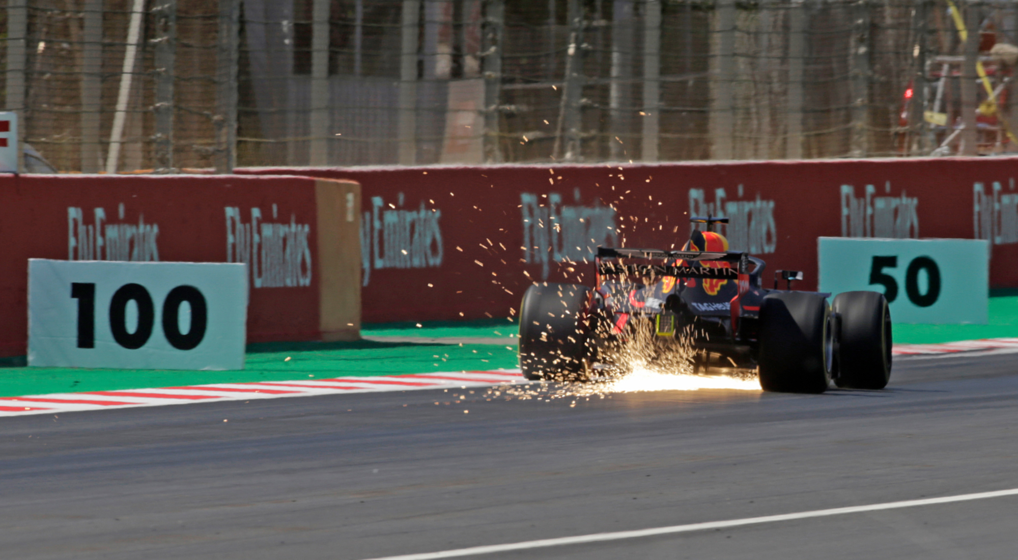 Max Verstappen's Red Bull with sparks flying at the Circuit de Catalunya