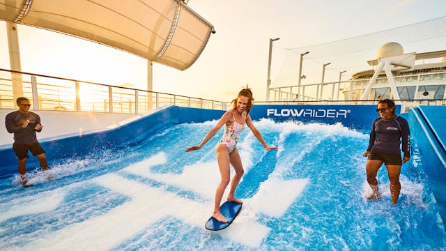 Guest enjoying the FlowRider onboard Wonder of the Seas