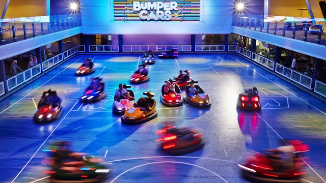 Families enjoying the bumper cars in the seaplex onboard Royal Caribbean's Anthem of the Seas.
