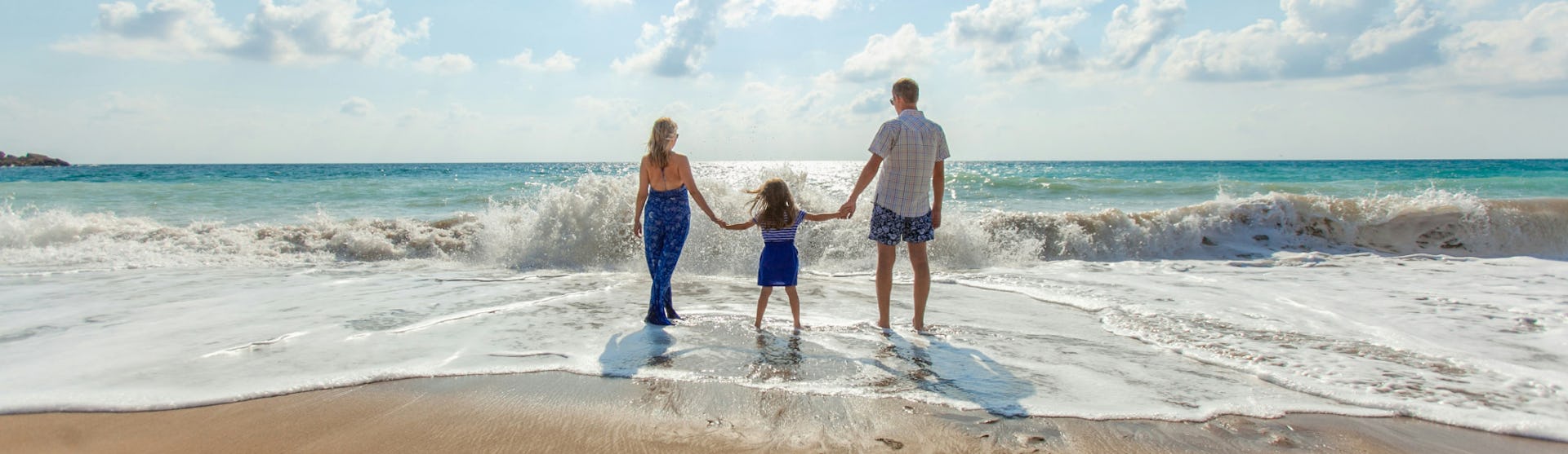 Family enjoying a day at the beach during a cruise with Paramount Cruises